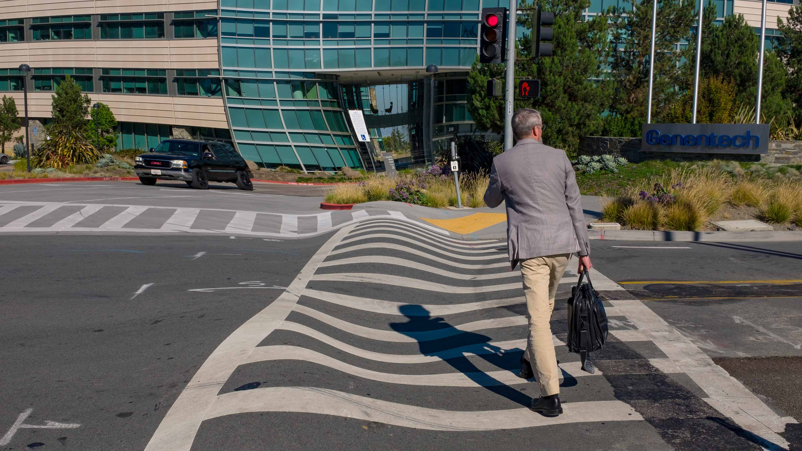 Lines that should appear straight, like the lines of a crosswalk, may look wavy or warped.