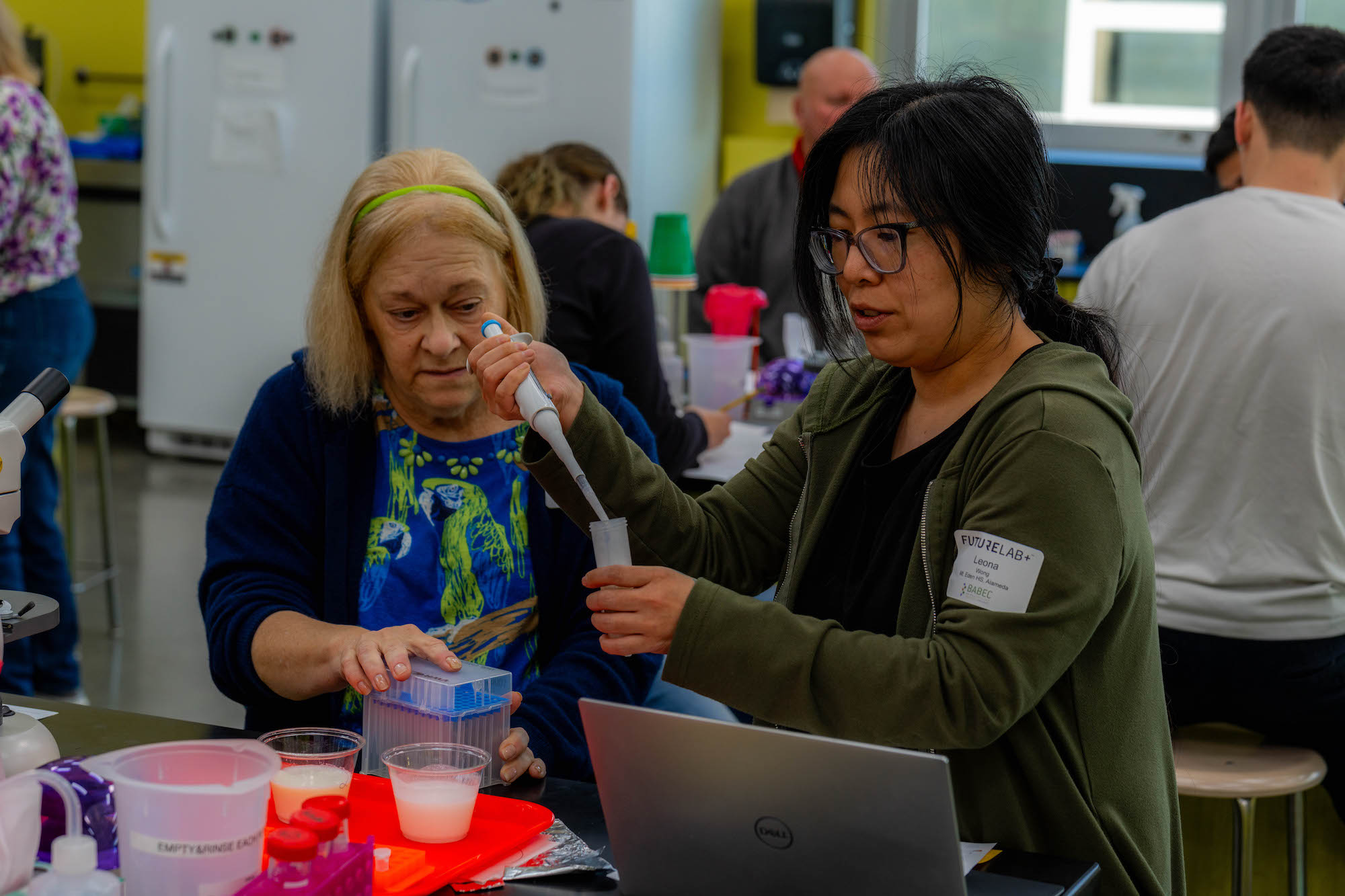 Two participants in Futurelab+ professional development programs use micropipettes to conduct a biotech lab experiment that they can adapt and integrate into their own lesson plans.