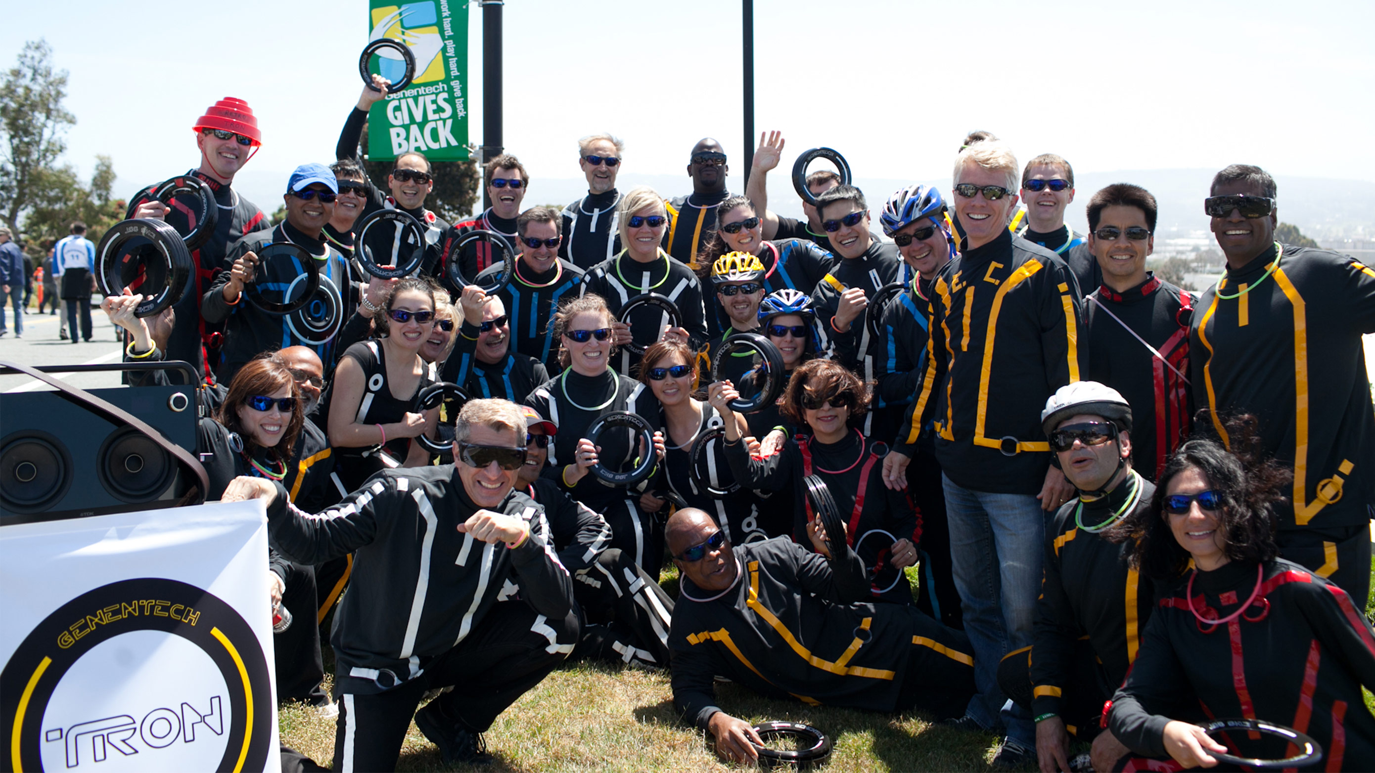 Former CEO Ian Clark (fourth from top right) joins Genentech employees dressed as Tron during the 2011 Genentech Gives Back Week Bay to Breakers Children’s Walk. 